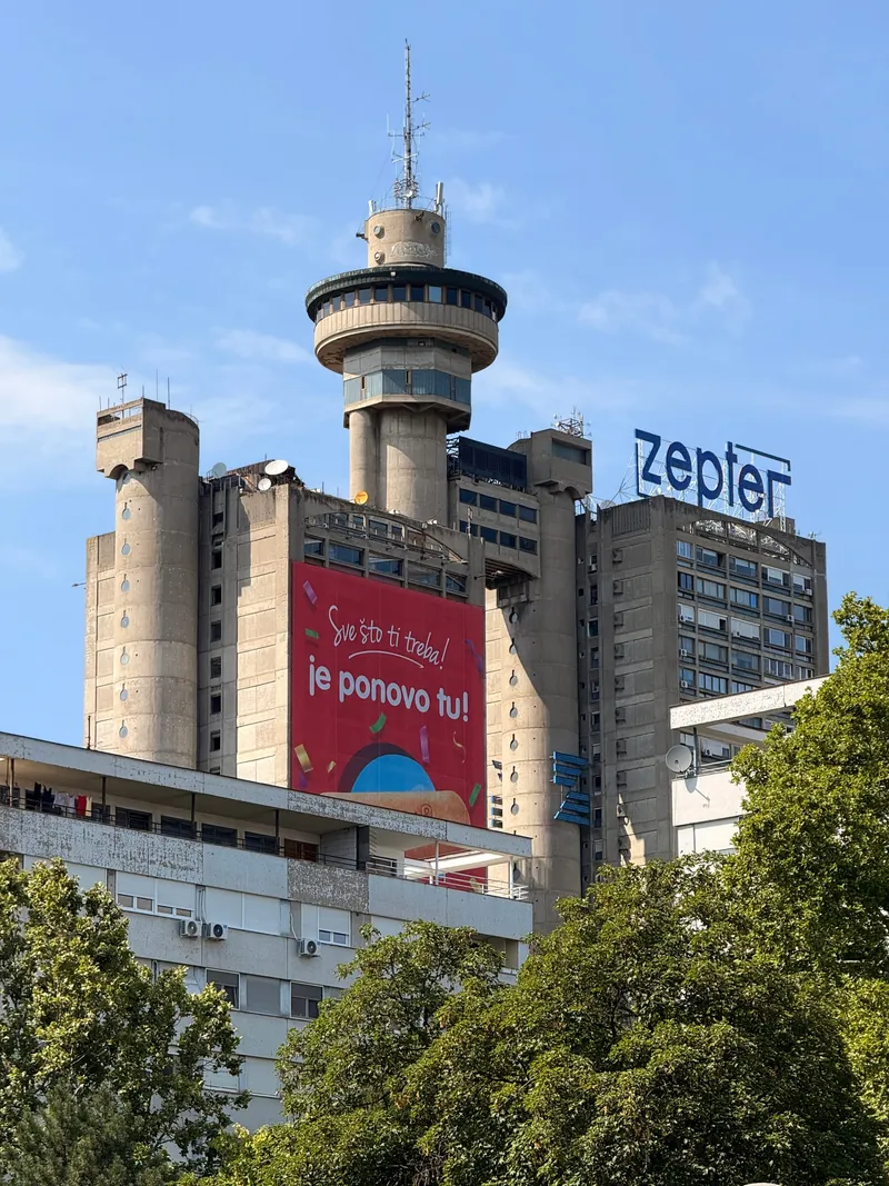The Genex tower (Western City Gate) seen from the street, twin towers joined by a bridge