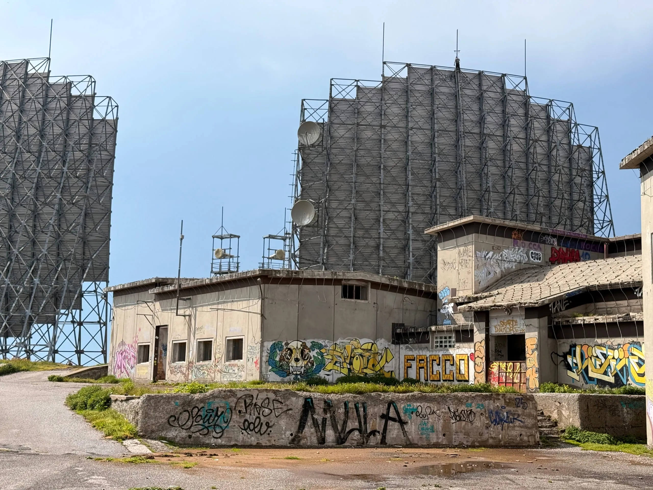 The tropospheric-scatter antenna panels and bunkers of NATO station IDGZ on a Brescian summit