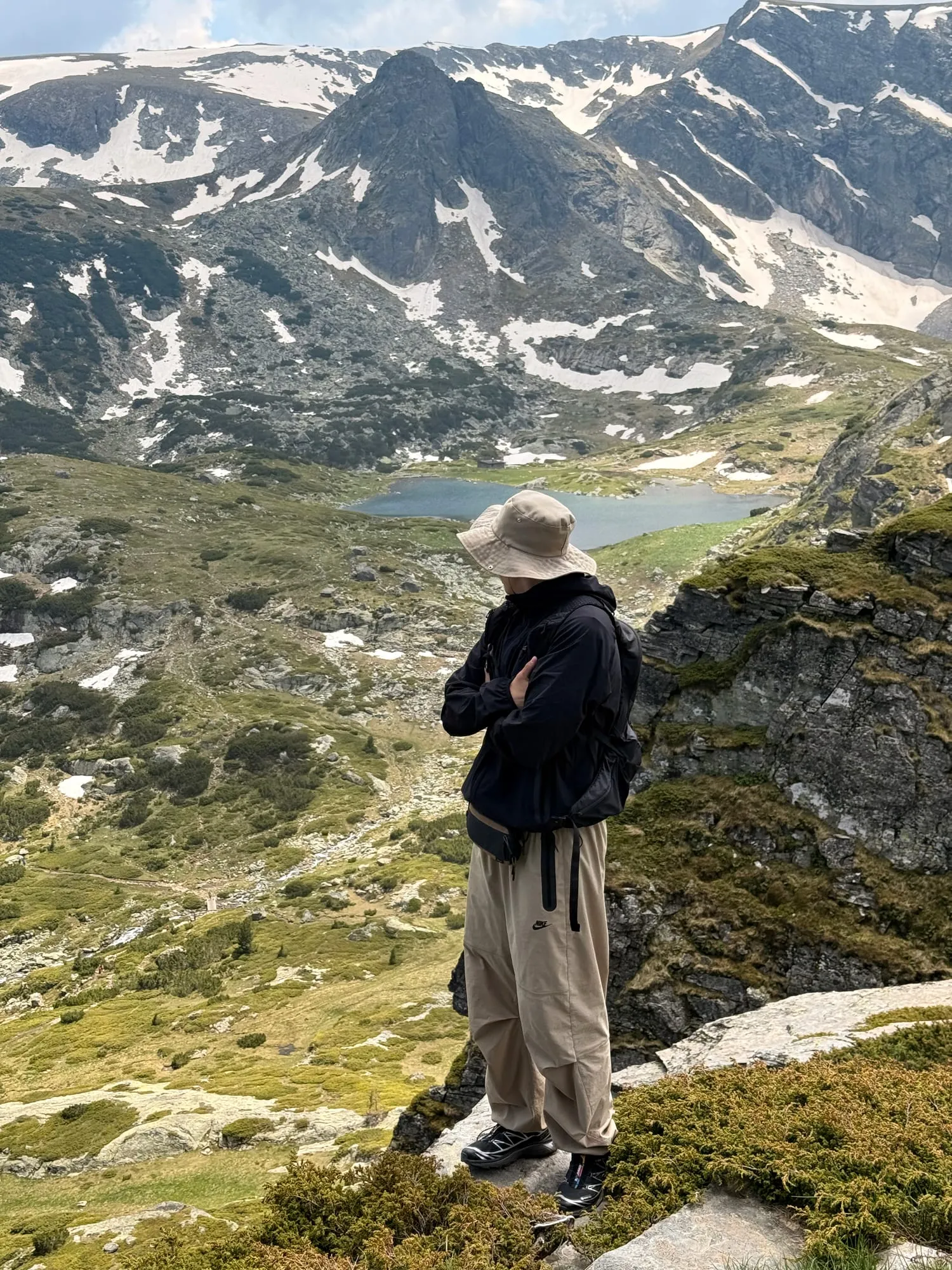 Alexandr on a mountain ridge above a glacial lake