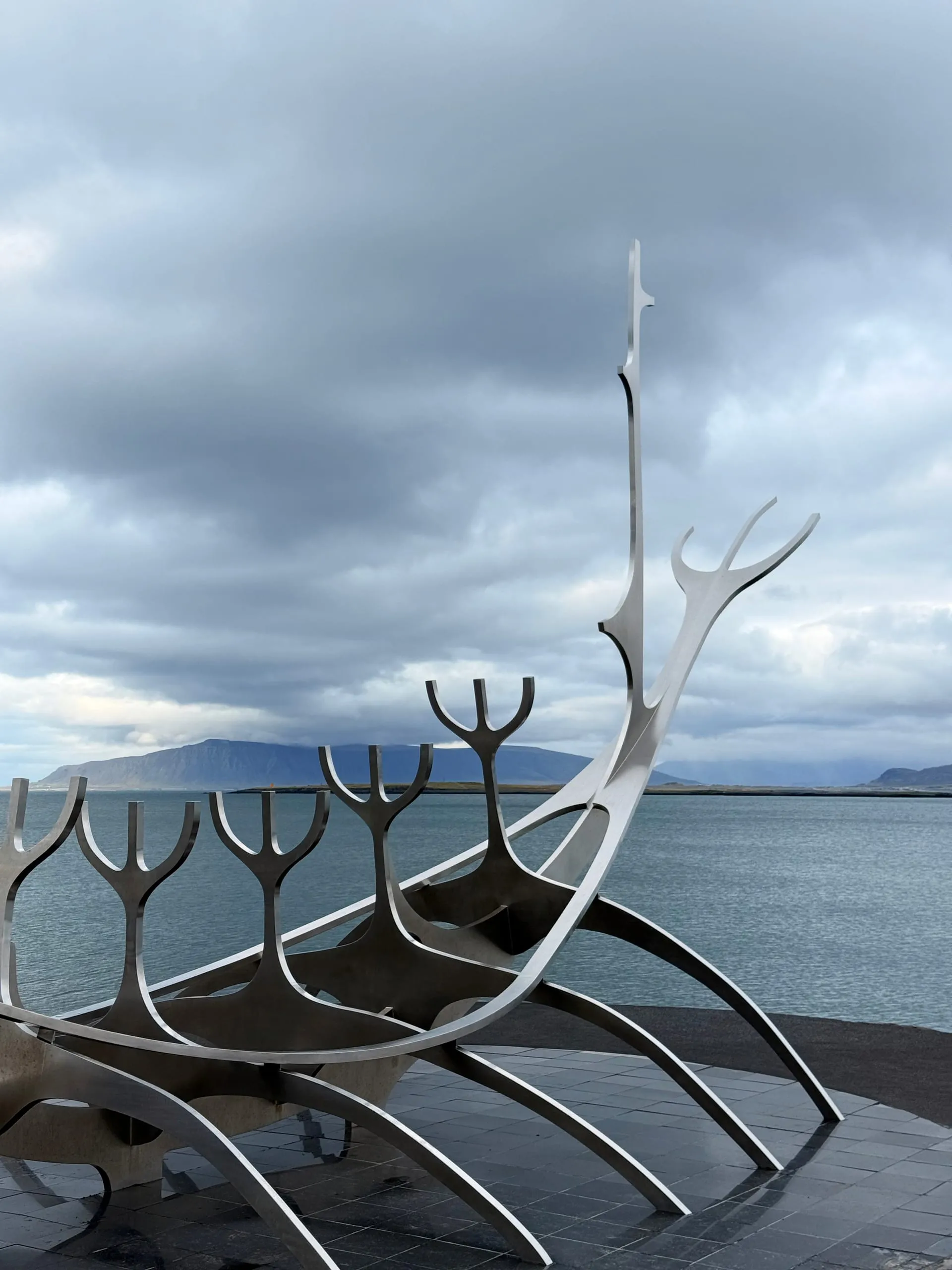 Last stop before the airport — Sólfar on the Reykjavík waterfront, with the weather coming back in